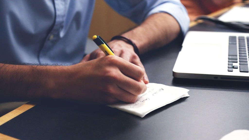 A Film professional takes notes about their TV script
